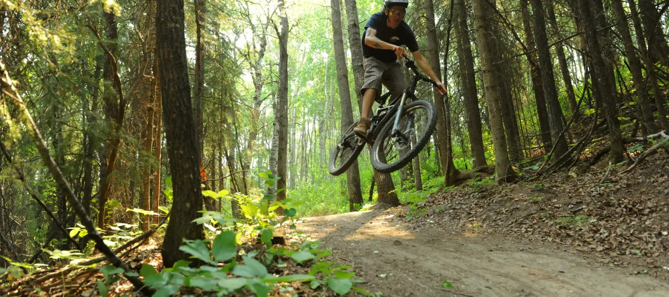 Hucking into South Bear Creek bike trails, Grande Prairie, AB.