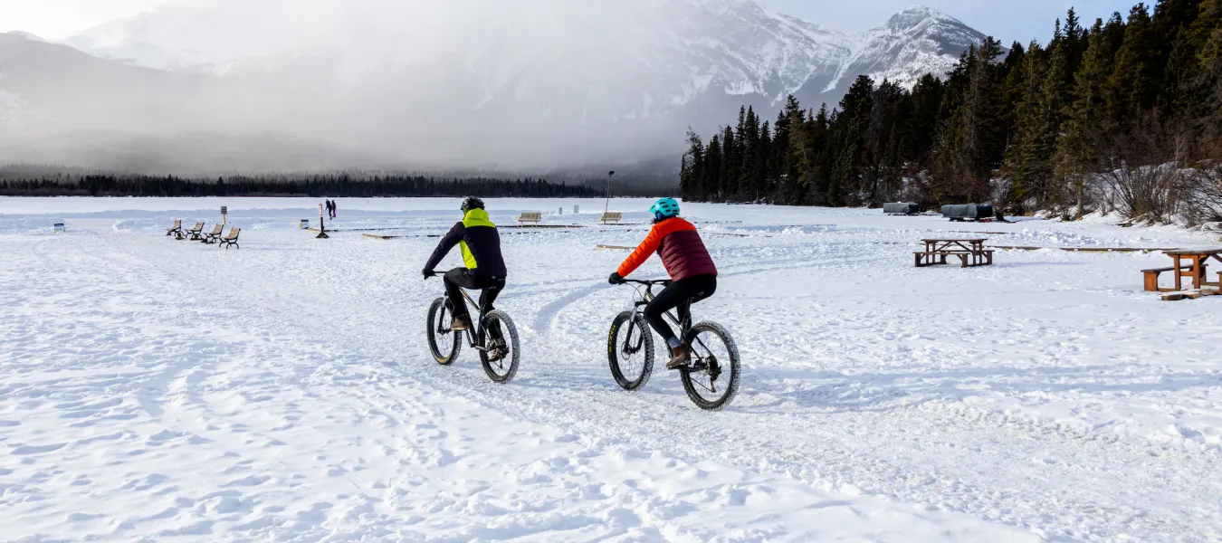 Jasper Alberta fatbiking couple on Pyramid Lake Paul Lavoie SnowSeekers