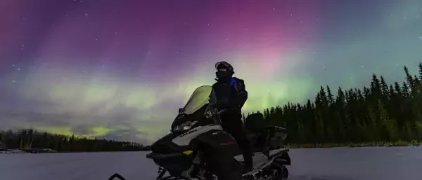 Northern lights aurora photography snowmobile Paul Lavoie