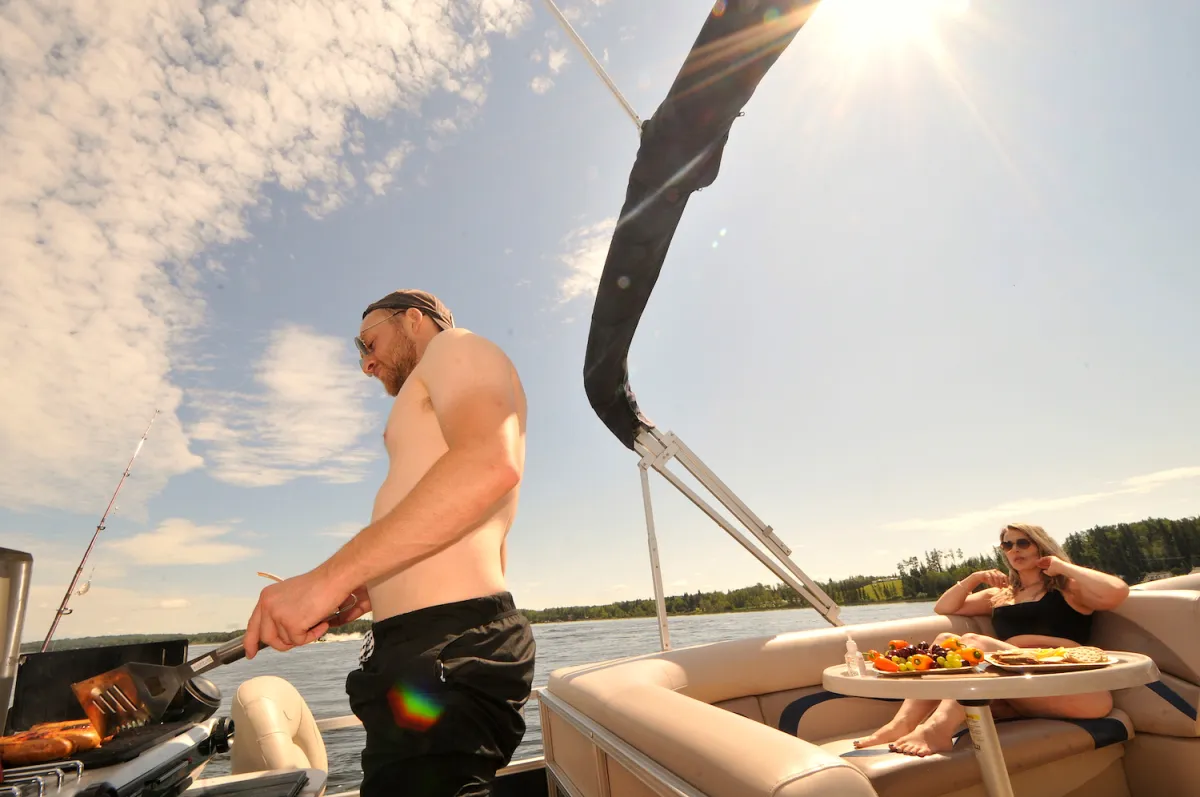 A couple on a boat in Athabasca lake