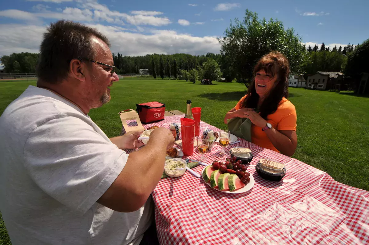 A couple enjoy a picnic in Lac La Biche Plamondon