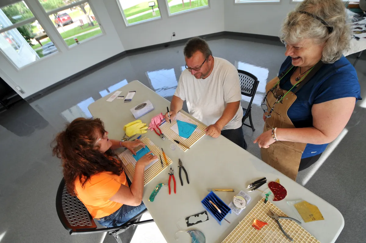 A couple learning how to stain glass in Plamondon Lac La Biche