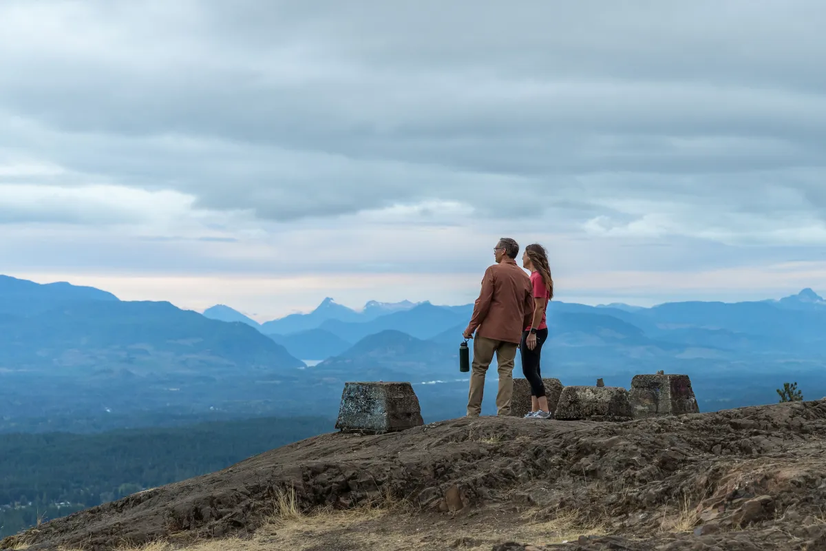 Hikers enjoy the view from Alberni Lookout, Port Alberni, BC.