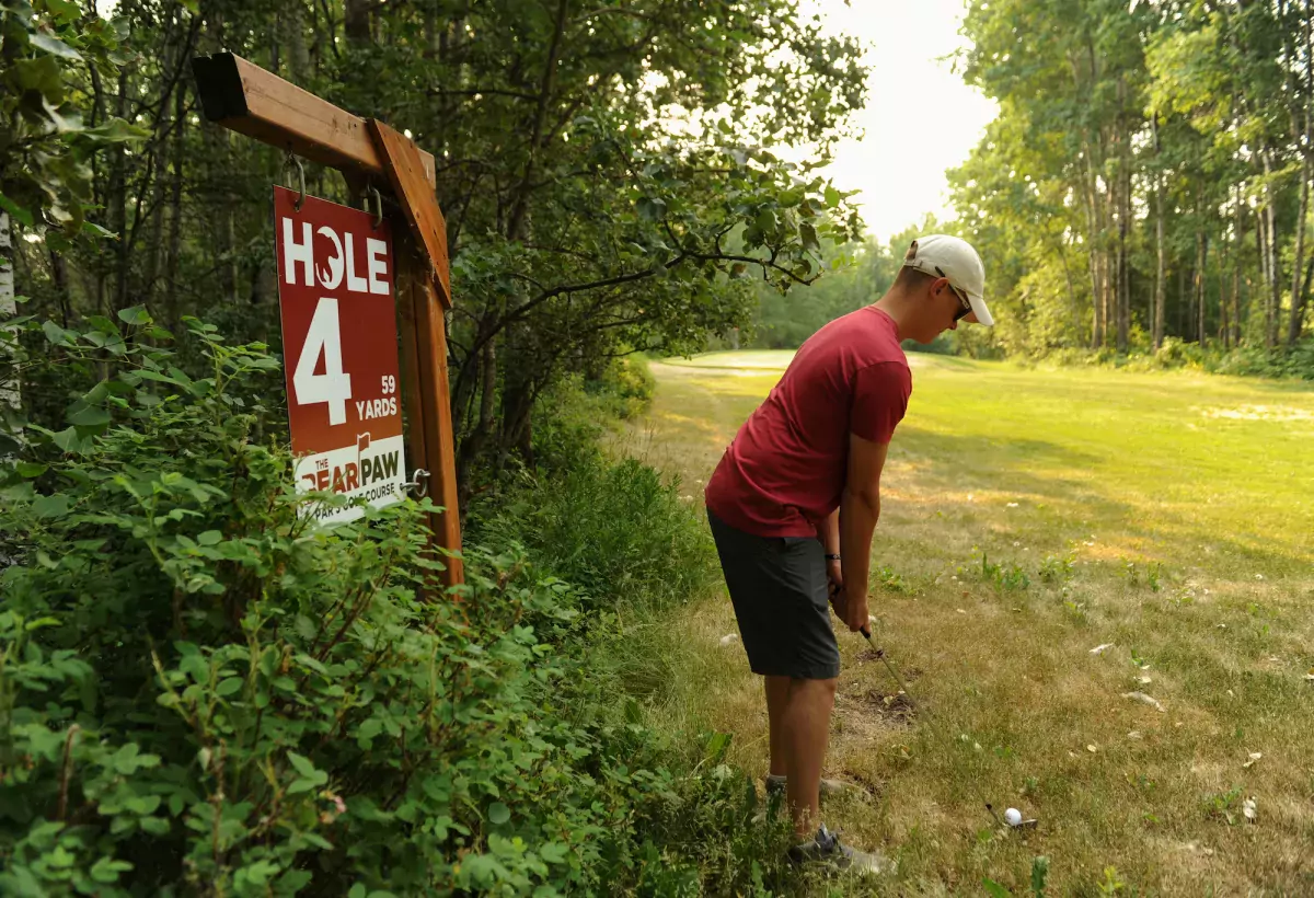 Brett Mace lines up his shot at Bear Paw Par 3 Golf Course in Grande Prairie, AB.