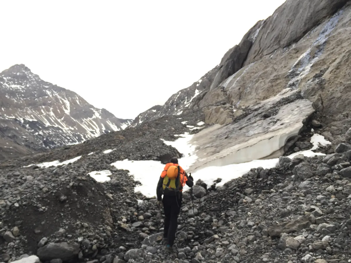 A high alpine hiker hiking with a backpack