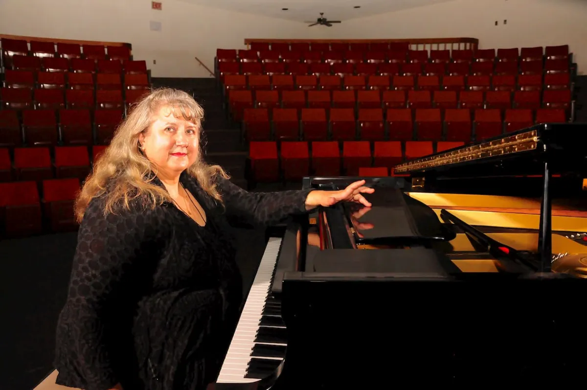 Ida Edwards plays piano in Athabasca