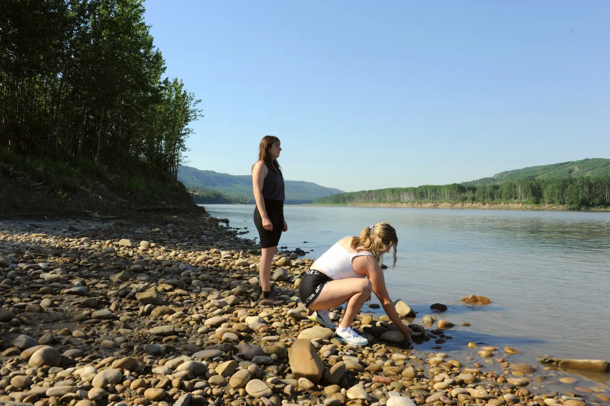 Skipping rocks on the Smoky River at Murphy's Flats, Northern Sunrise County, AB.