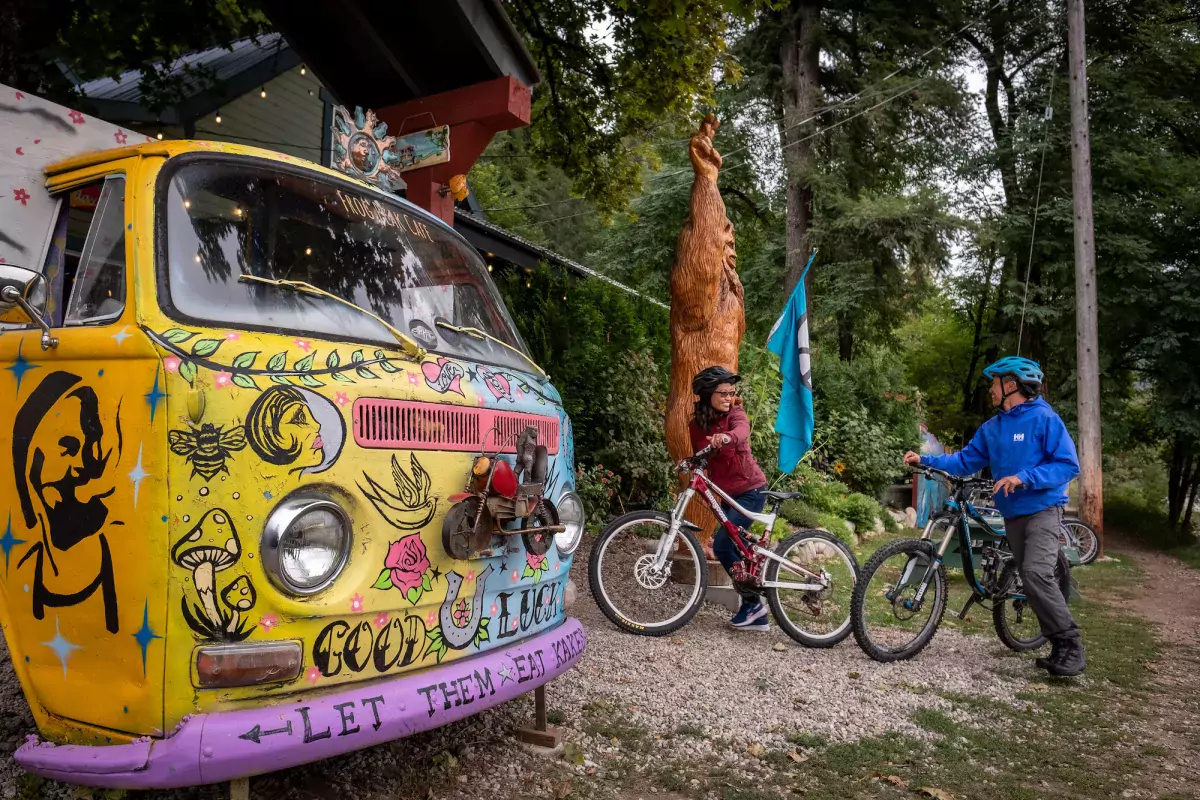 Cyclists at Frog Peak Cafe, Arrow Lakes, BC.