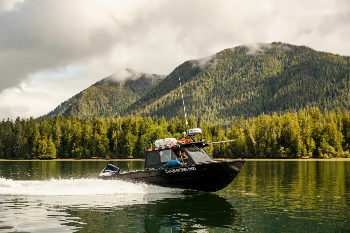 Tla-o-qui-aht Tribal Parks guardians boating to Meares Island, BC