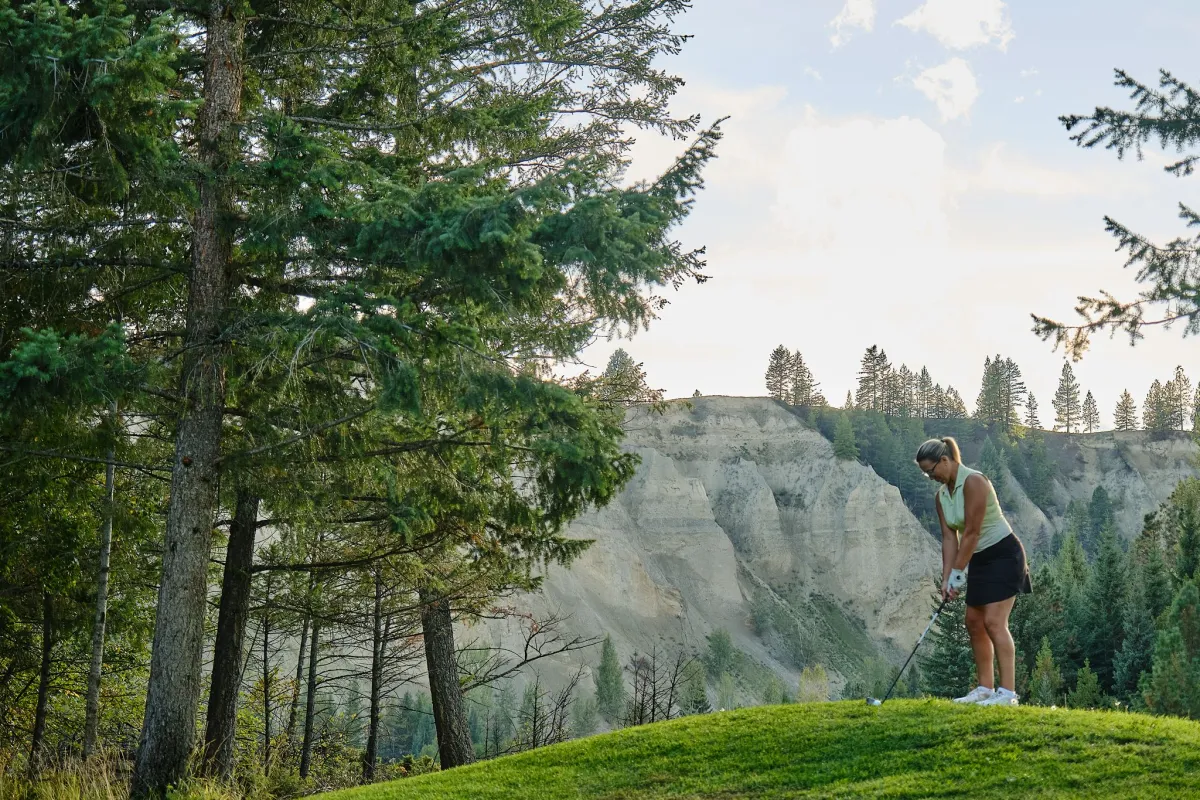 A women golfing at St. Eugene Golf Resort & Casino outside Cranbrook