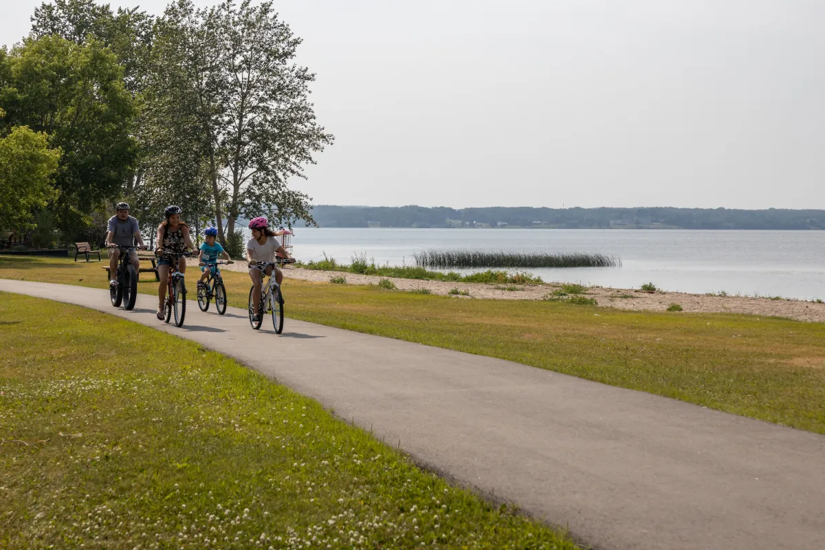 Biking by the waterfront in Lac La Biche, AB.