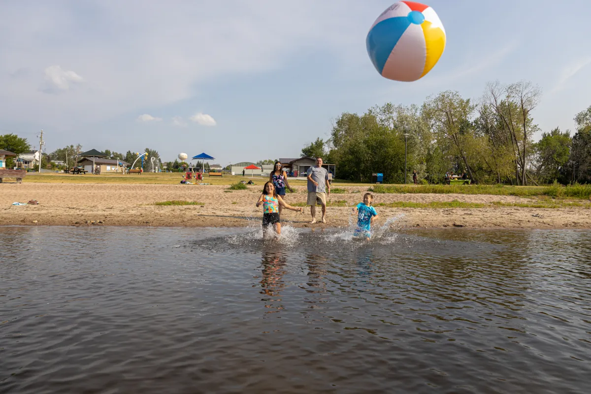 Beach ball fun at McArthur Park waterfront in Lac La Biche, AB.