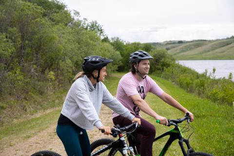 Riding bikes along the lake at Vermilion Provincial Park