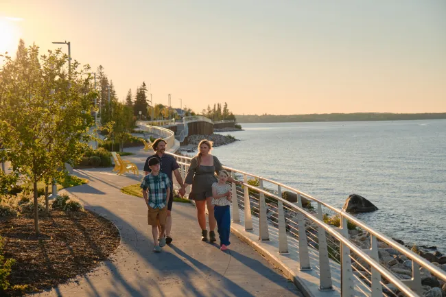 Family strolling Lakeshore Drive in Cold Lake Alberta