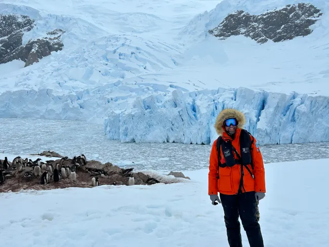 Antarctica Tyler Dixon with Penguins and Glacier 
