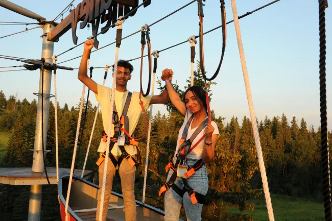 Celebrating at the top of the Snow Valley aerial park.