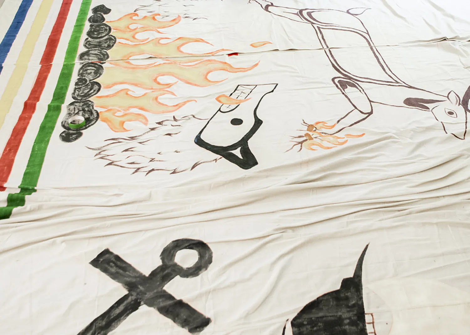 Ivy Cargill-Martin working on large scale Tla-o-qui-aht curtains that will be on display in the Tin Wis Conference Center, one of the many highlights of the naaʔuu evenings.